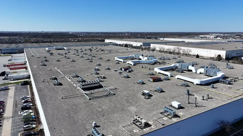 Distribution Center — 530,810 sq ft EPDM Ballast Re-Skin commercial roofing project by Windward