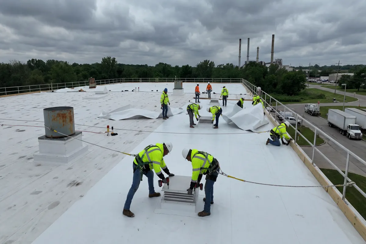 Windward Roofing crew performing commercial roof repair on a flat roof
